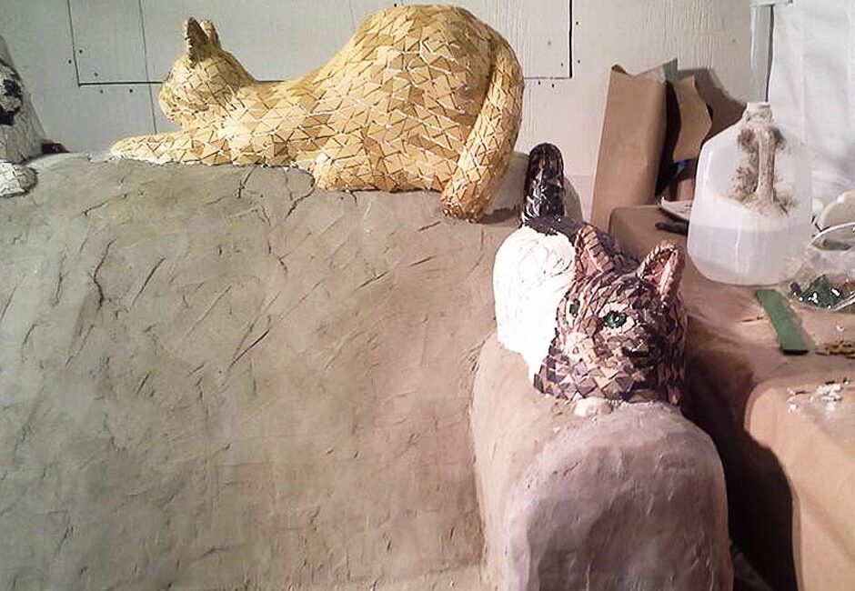 Concrete cats on concrete couch