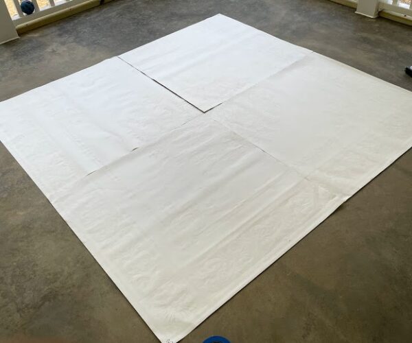 Stenciled area covered while applying Amber and Malayan Buff acid stain around it