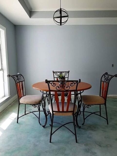Blue acid stain concrete dining room floor