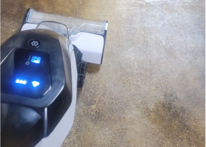 An image showing a wet vacuum being used to efficiently and quickly remove water and residue during the neutralizing process, contributing to a more streamlined and effective workflow.