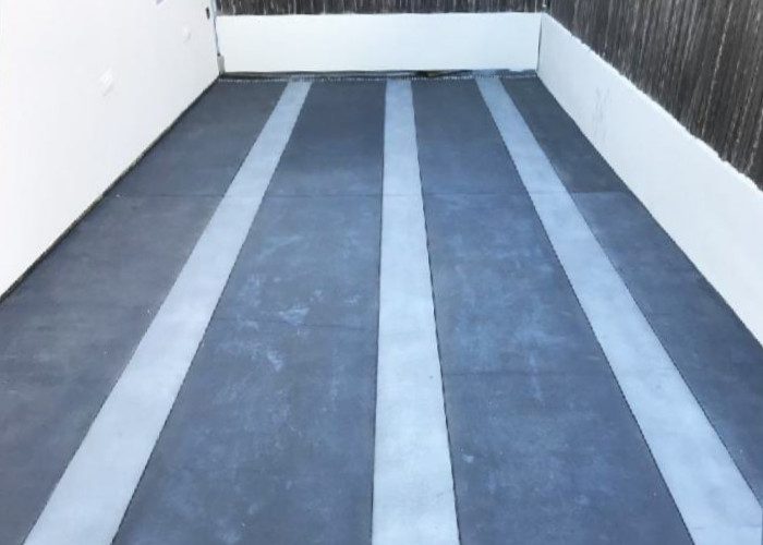 Final Result of Stained Concrete Driveway with a Stunning Design featuring Stormy Gray and Light Slate Color Bands.
