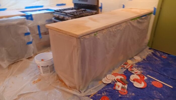 Beachfront colored concrete overlay over formica kitchen countertop