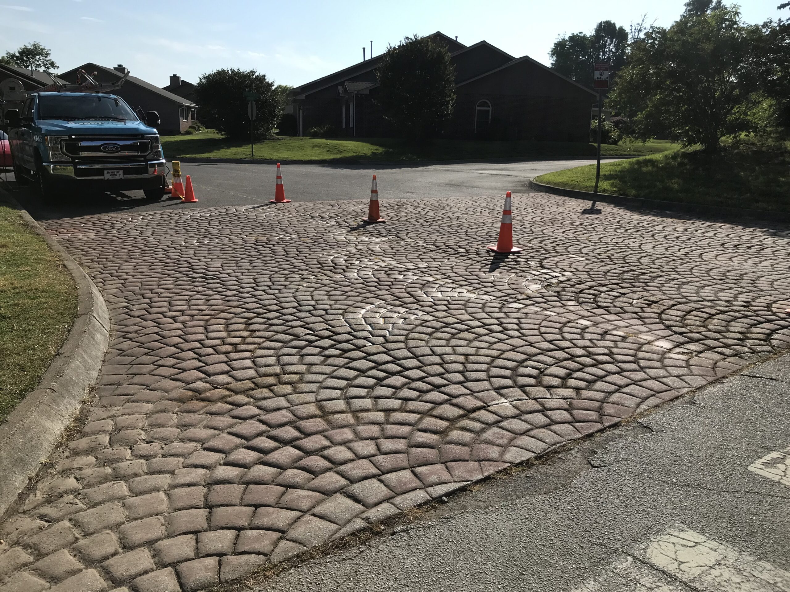 Faded and cracked entrance pavers before restoration