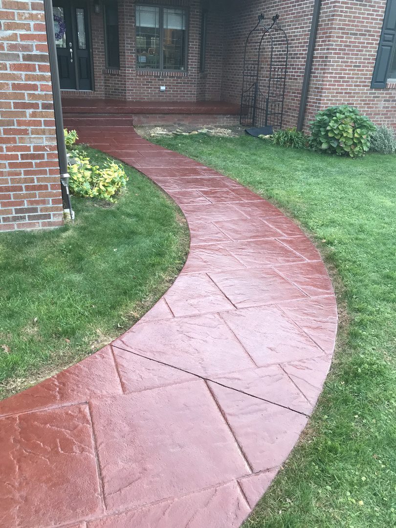 Front walkway and entrance floor beautifully stained with rich Cinnabar leading to the front door