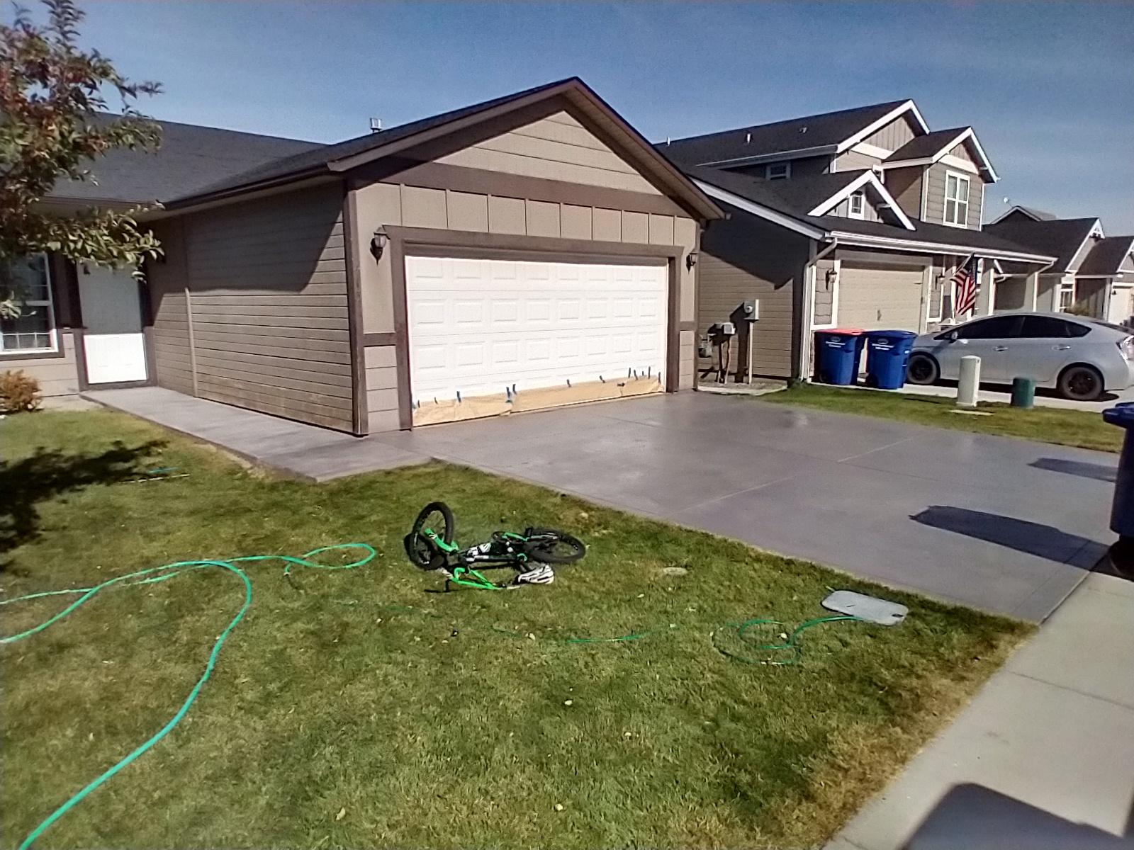 Driveway Stained with Silver Gray EasyTint Tinted Sealer