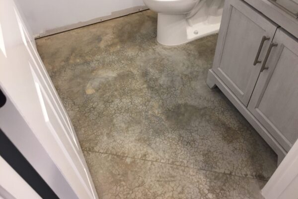 Unfinished bathroom area with bare concrete floor