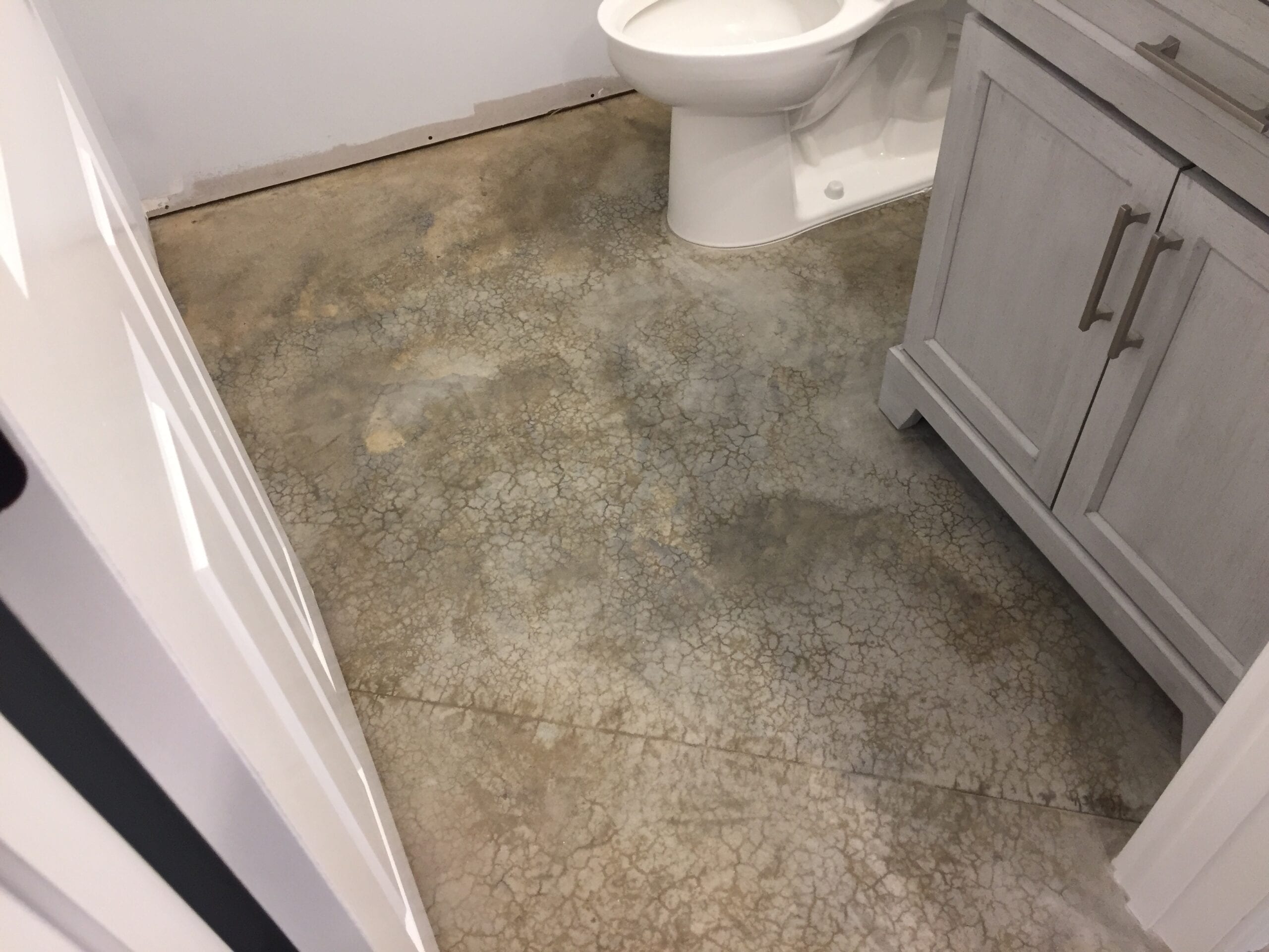Unfinished bathroom area with bare concrete floor