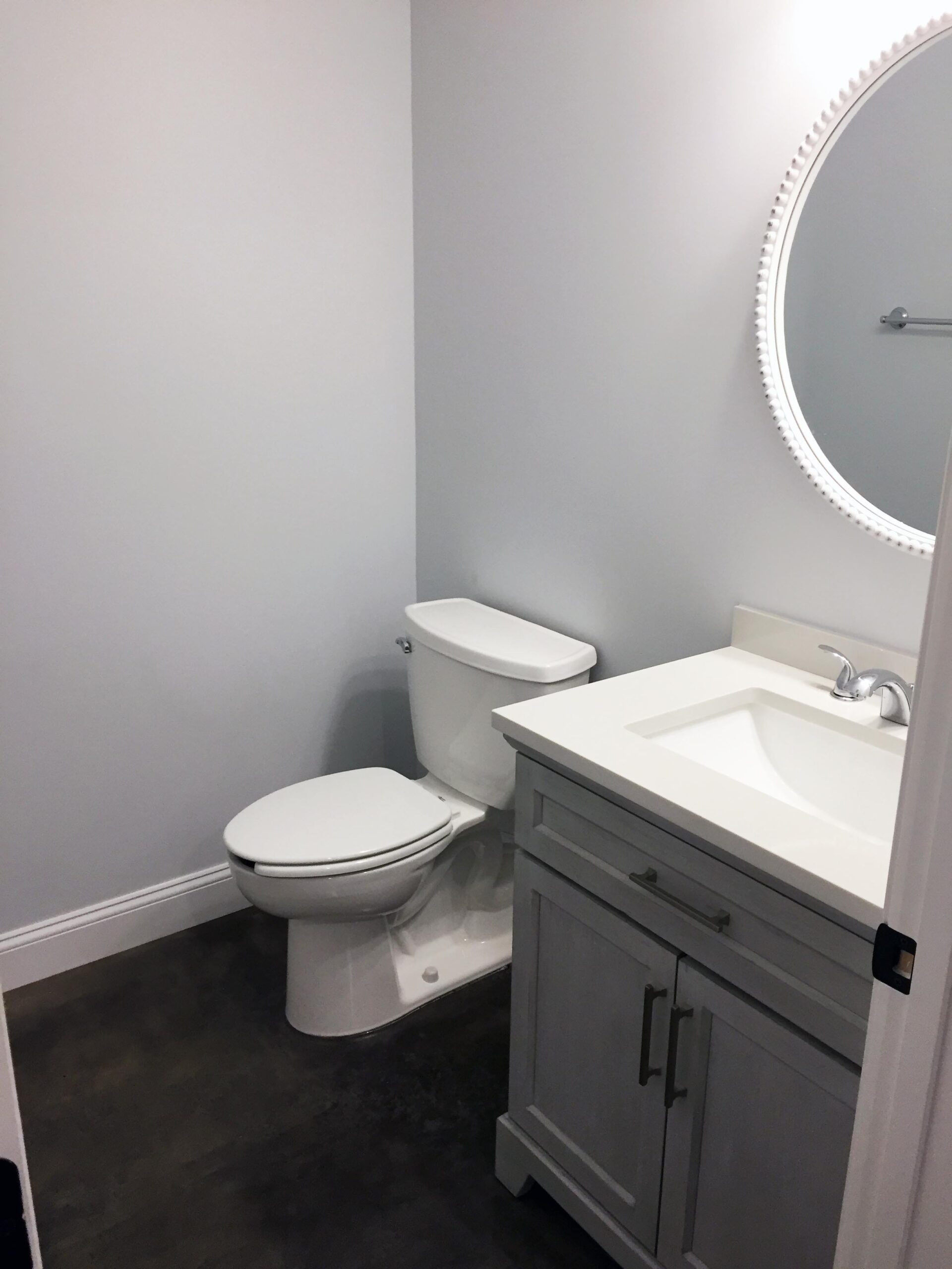 The same bathroom after applying Charcoal AcquaTint™, exhibiting a sophisticated and polished look