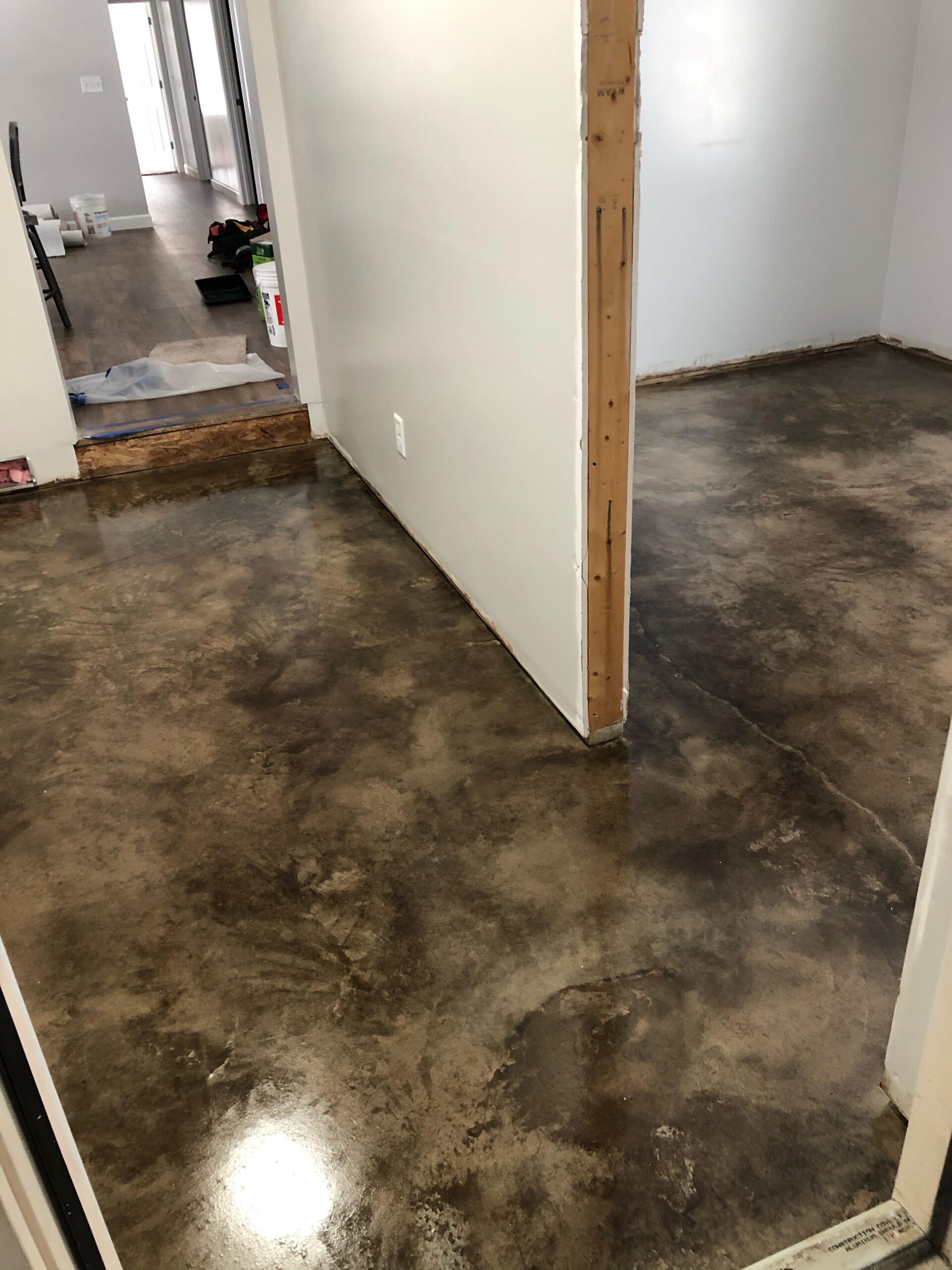 Mottled black acid stained concrete floor