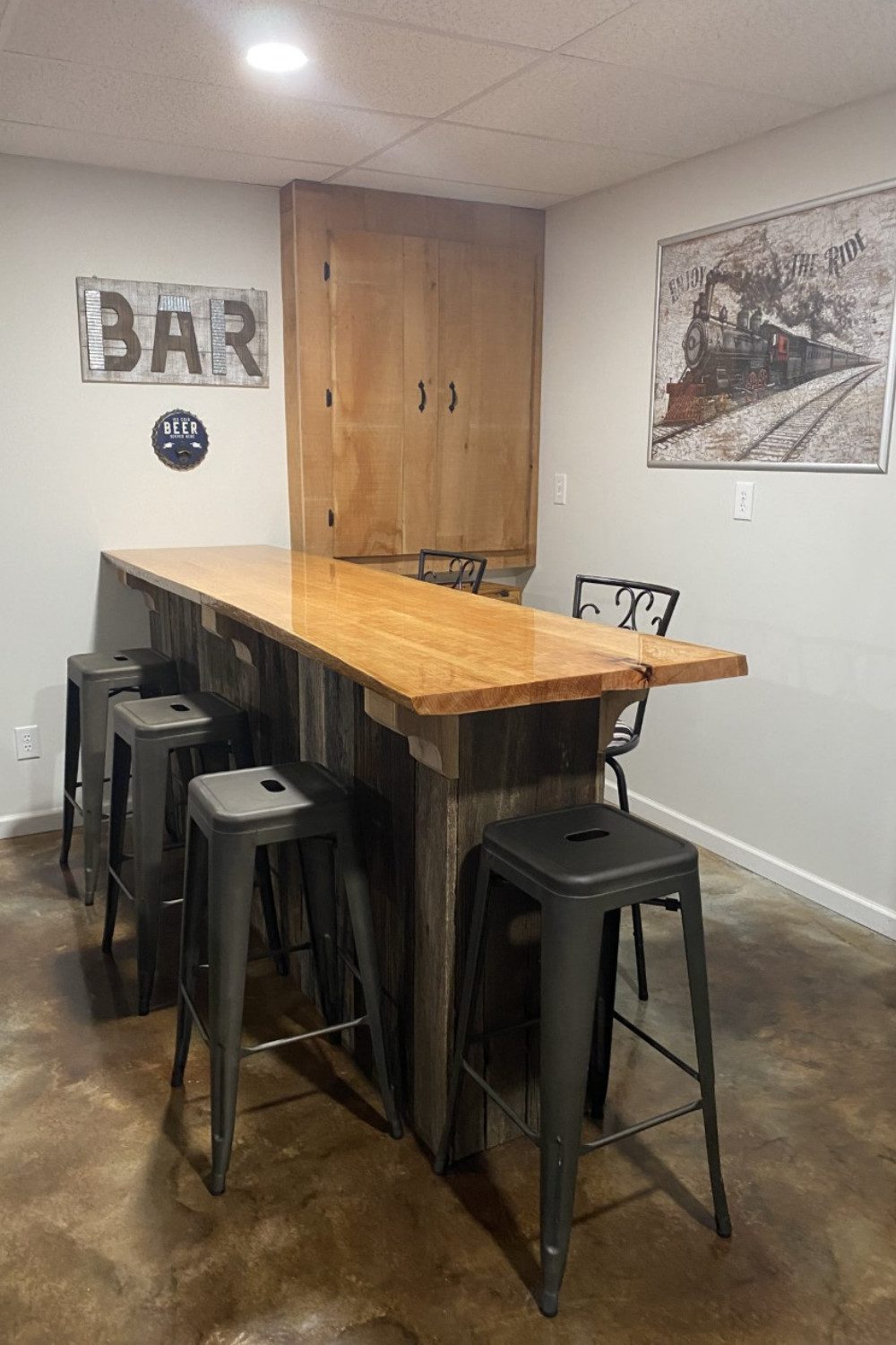 A plain concrete floor transformed into a stunning leather look with coffee brown and desert amber acid staining.