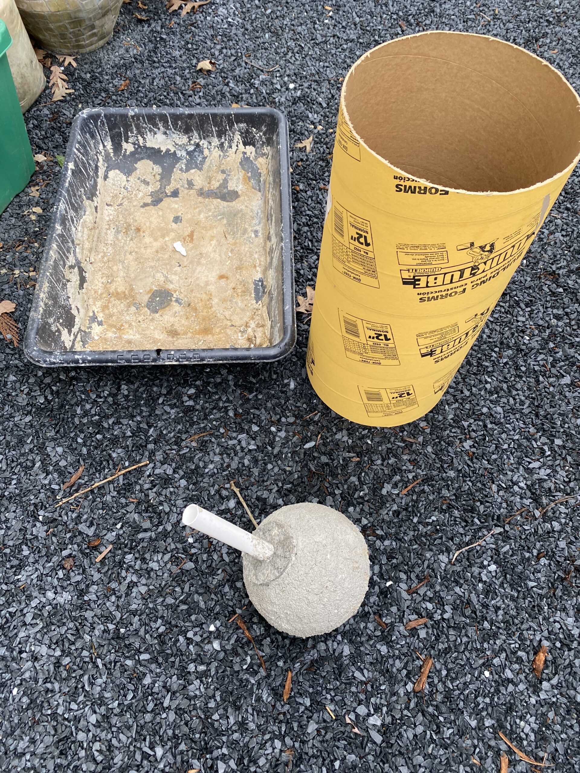 An array of materials and tools used for creating a DIY concrete fountain