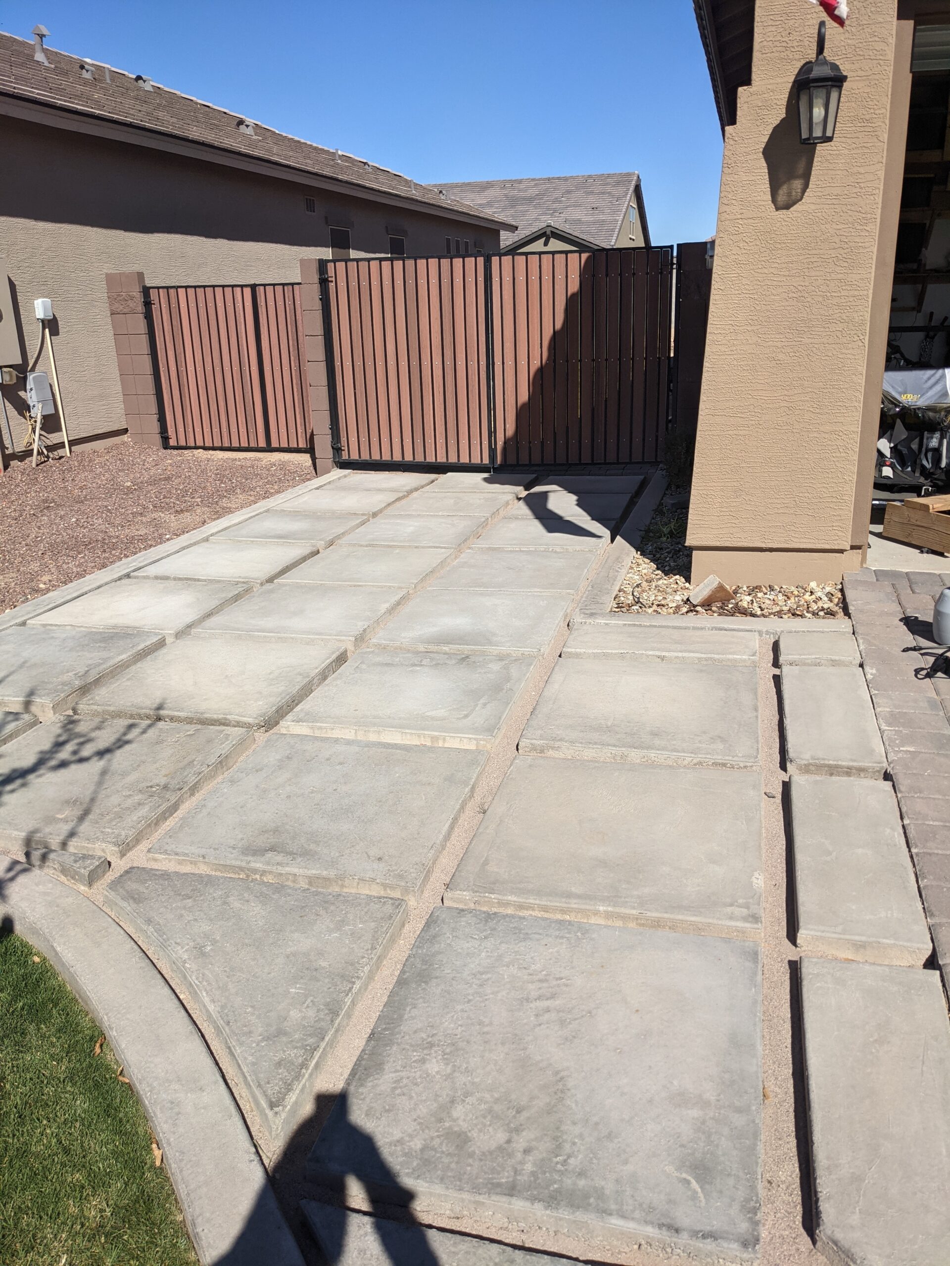 Unstained concrete driveway extension