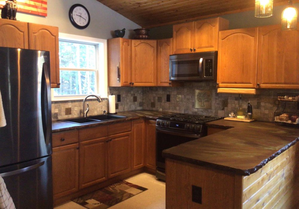 A finished concrete countertop, richly stained with a mix of Coffee Brown, Desert Amber, and Seagrass