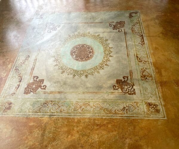 Finished and sealed porch floor showcasing the vibrant stencil design