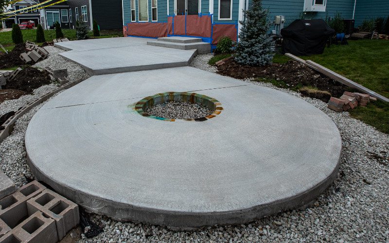 Acid stain color testing on small area of patio before staining entire surface