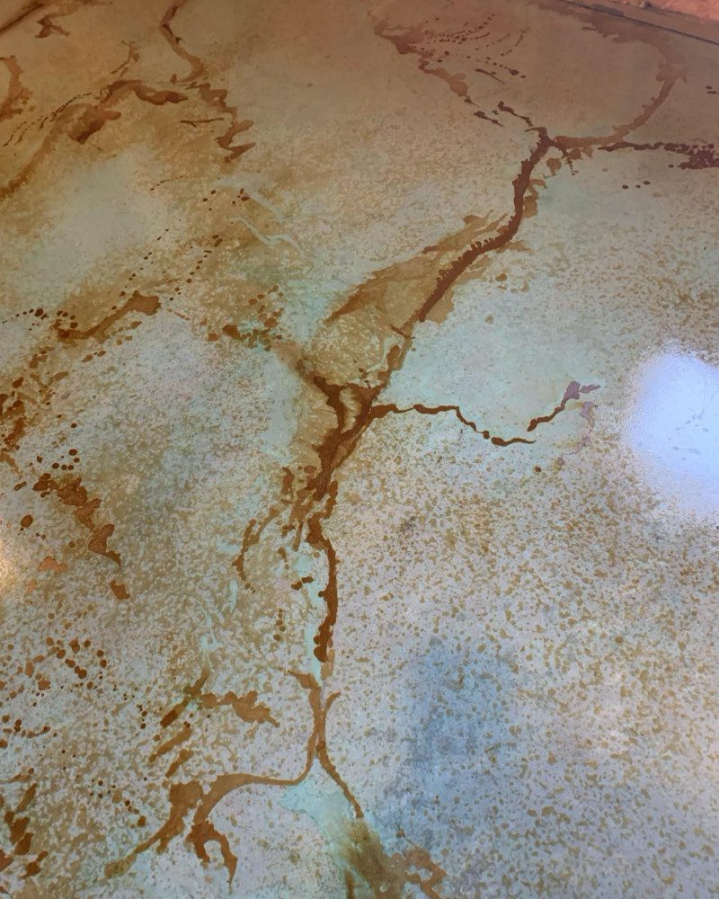 Stained concrete basement floor turned art