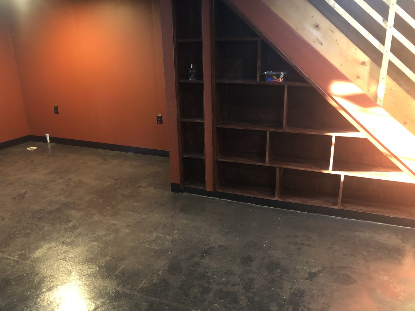 Basement floor after AcquaTint application showing improved appearance and color