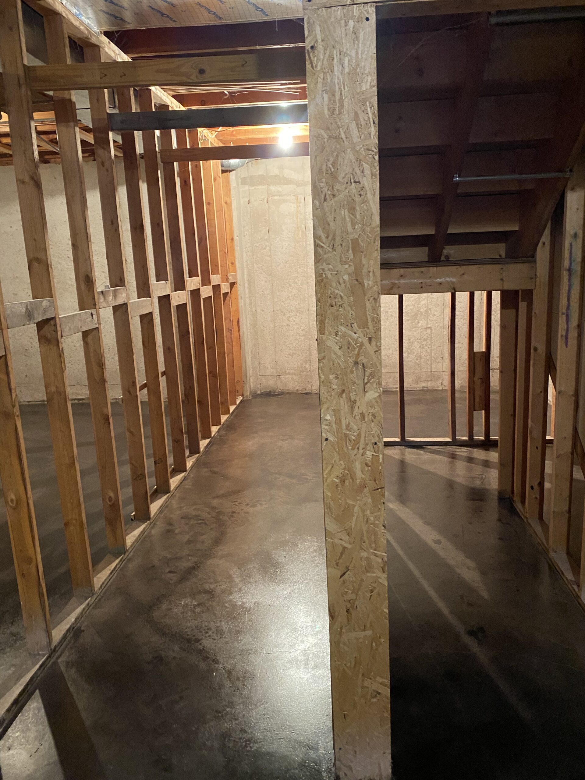 Finished basement showcasing the marbled look of Charcoal AcquaTint