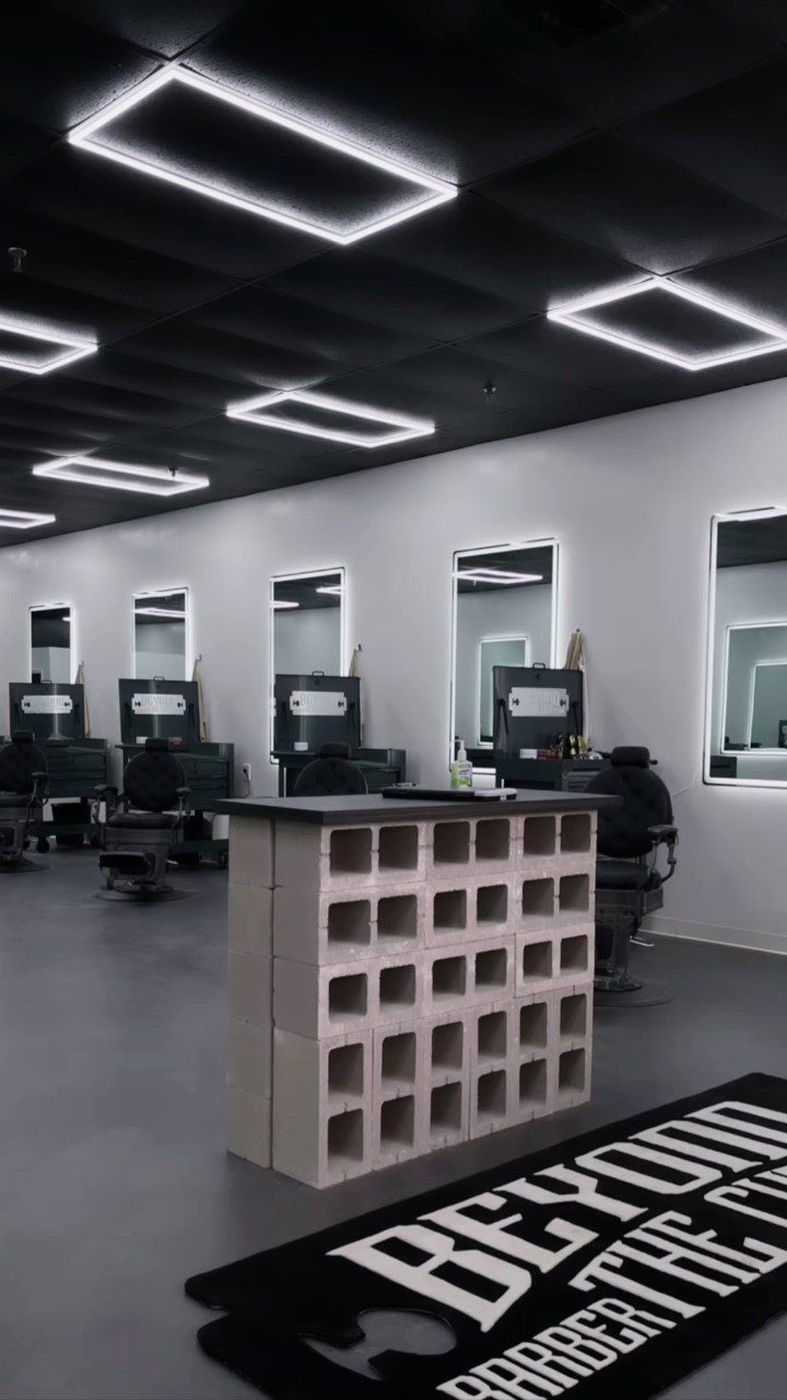 Image showcasing the modern, industrial-styled entrance of Beyond the Cut Barbershop, a testament to the diligent DIY efforts of the owner