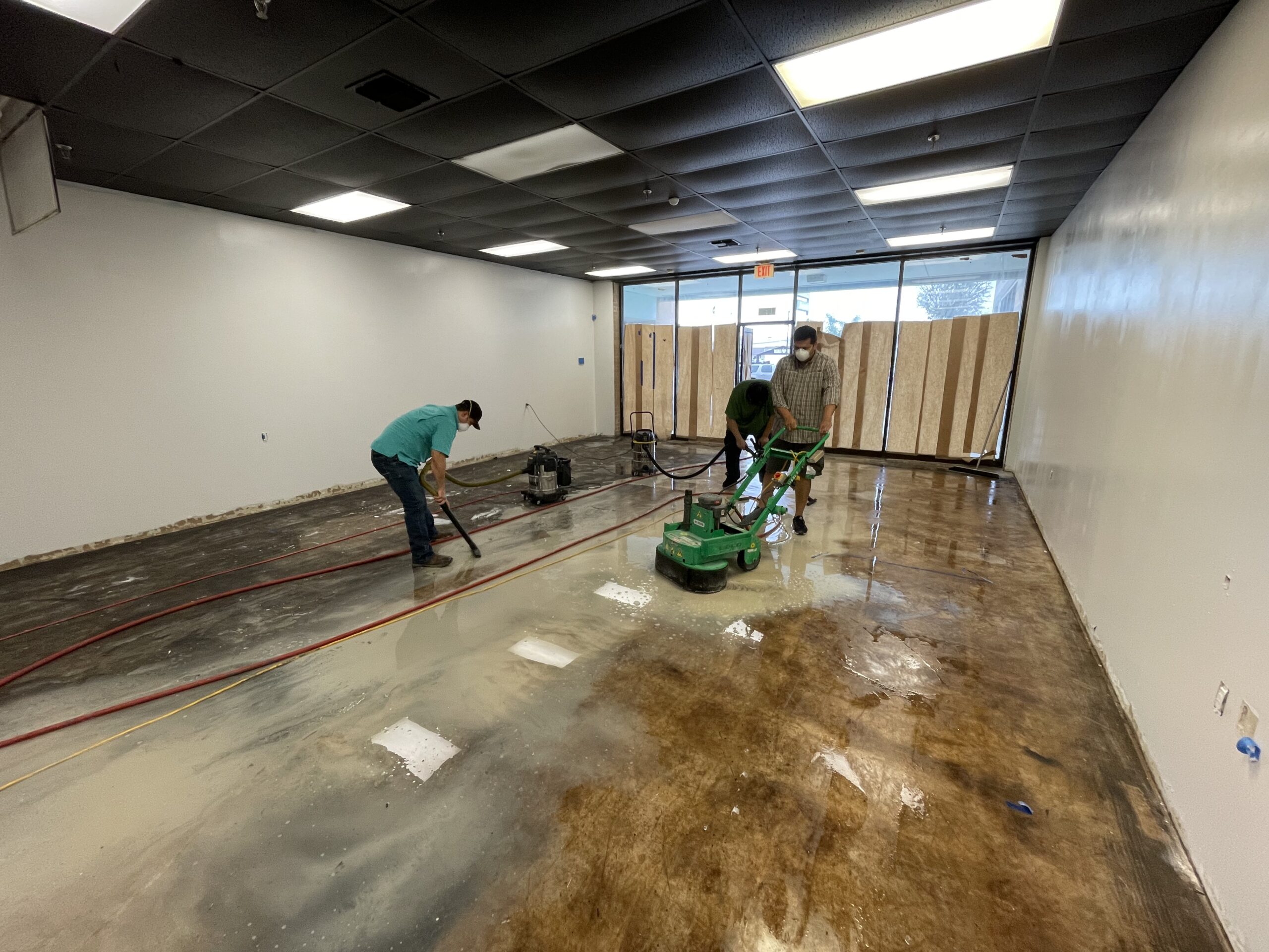 Image showing the dual disk grinder in action, methodically grinding down and cleaning the entire floor area