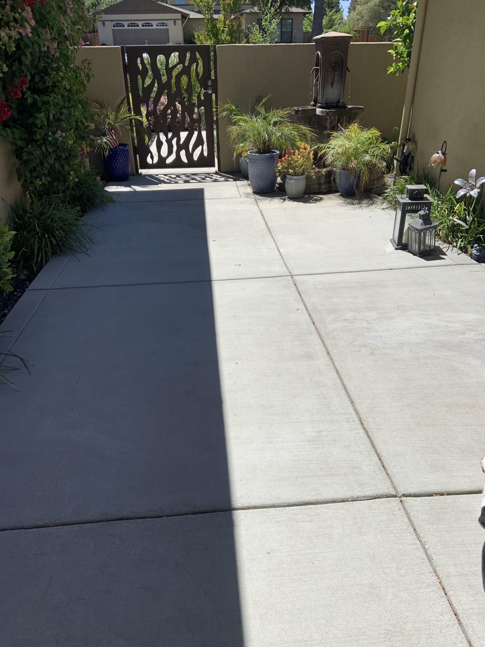 Clean, unstained 200 sq. ft. courtyard ready for application of Cola acid stain