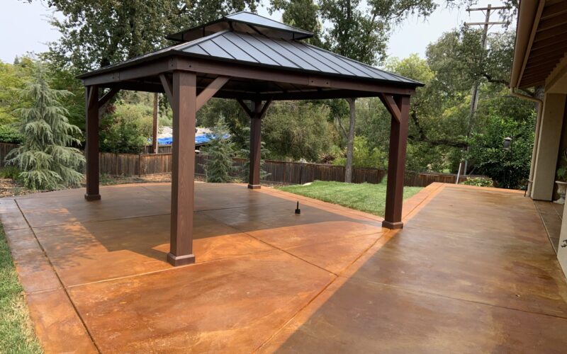 Cola EverStain stained broomed and scored concrete patio