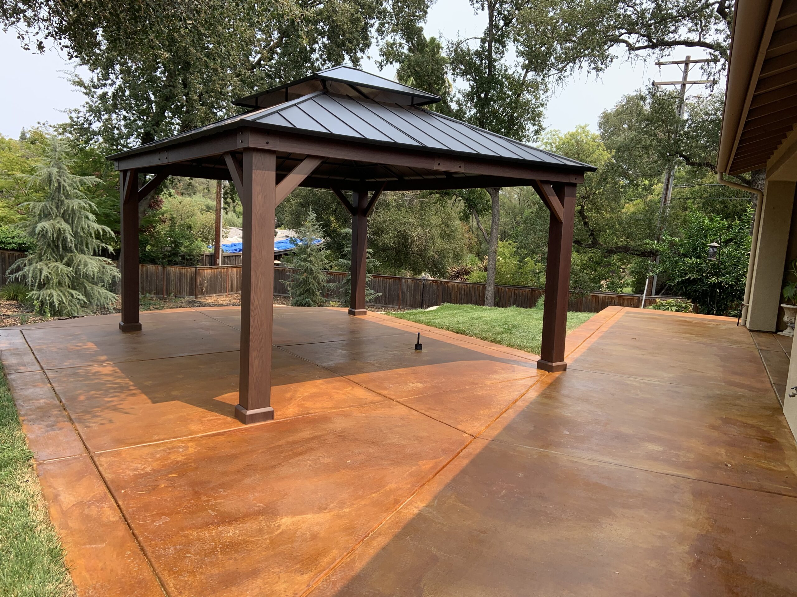 Cola EverStain stained broomed and scored concrete patio