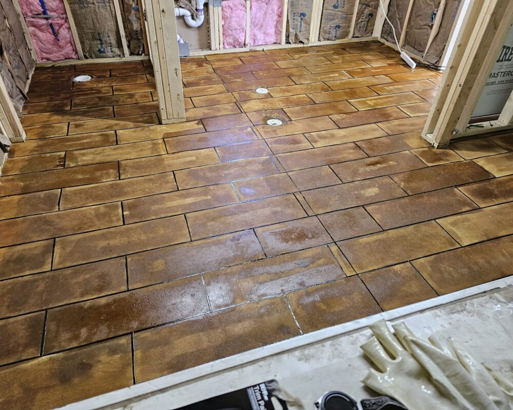 Freshly stained concrete floor in tile design, awaiting to dry