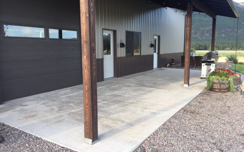 A bare outdoor space with unfinished concrete