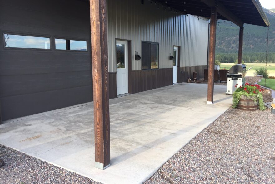 A bare outdoor space with unfinished concrete