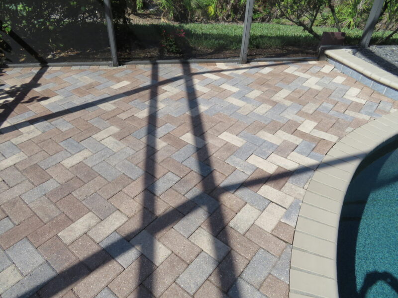 Stained pavers in vibrant hues of Aztec Brown, Khaki, and Silver Gray, waiting for sealer