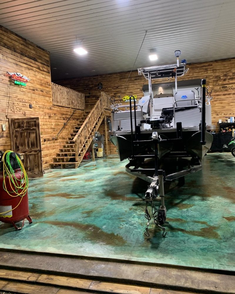 Boat parked on the vibrant, newly-stained garage floor
