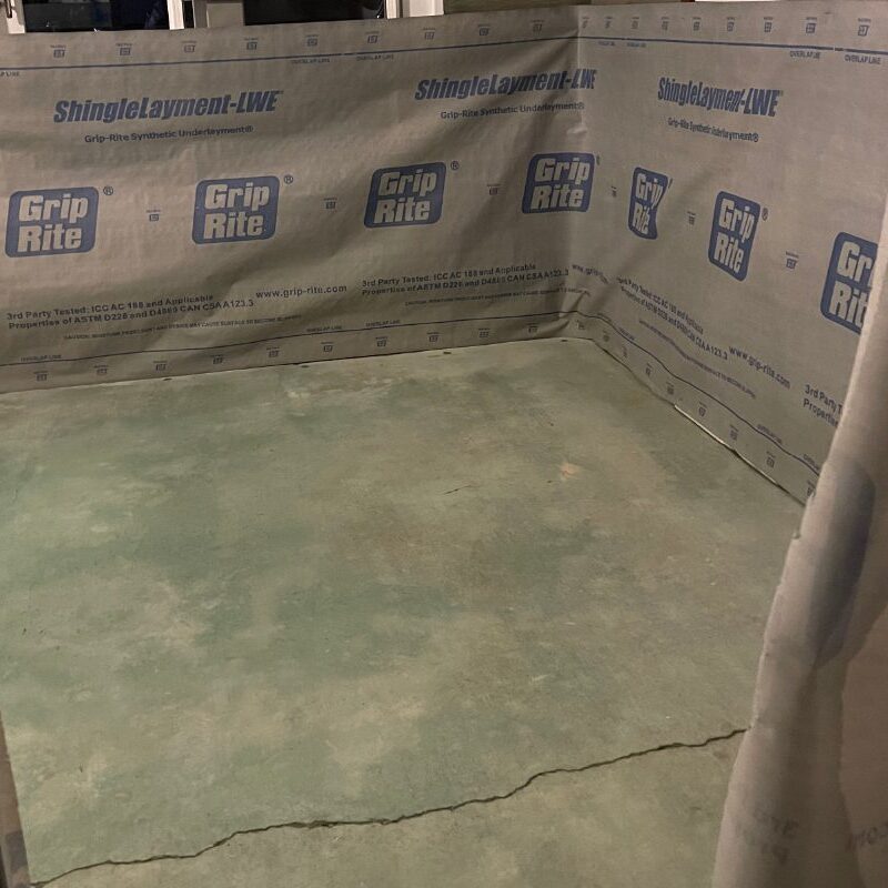 Sunroom floor midway through transformation, showing the application of Azure Blue acid stain