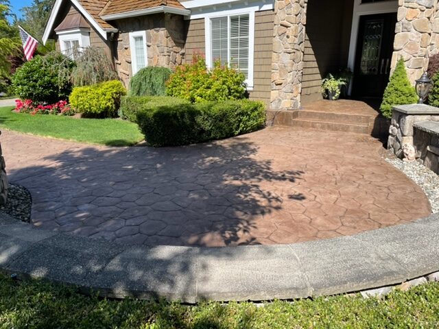stained stamped concrete walkway entry