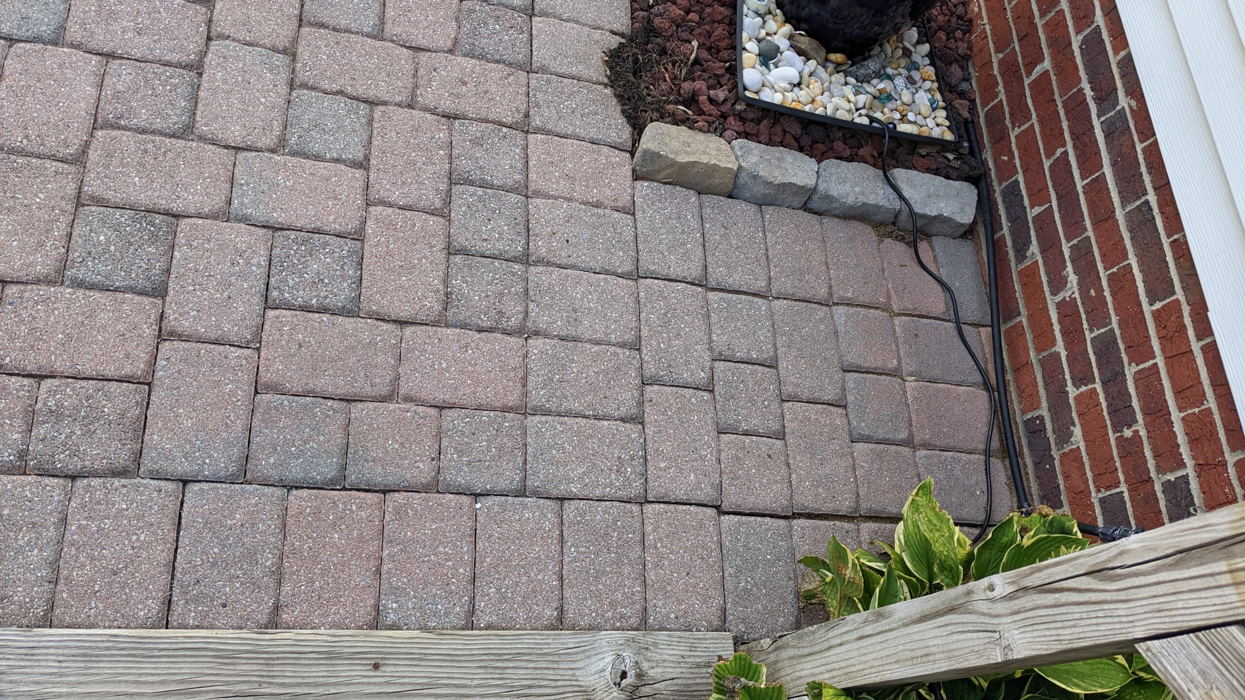 Faded concrete paver patio