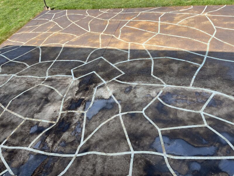 The patio surface showing a deepened color, 6 hours after black EverStain acid stain application