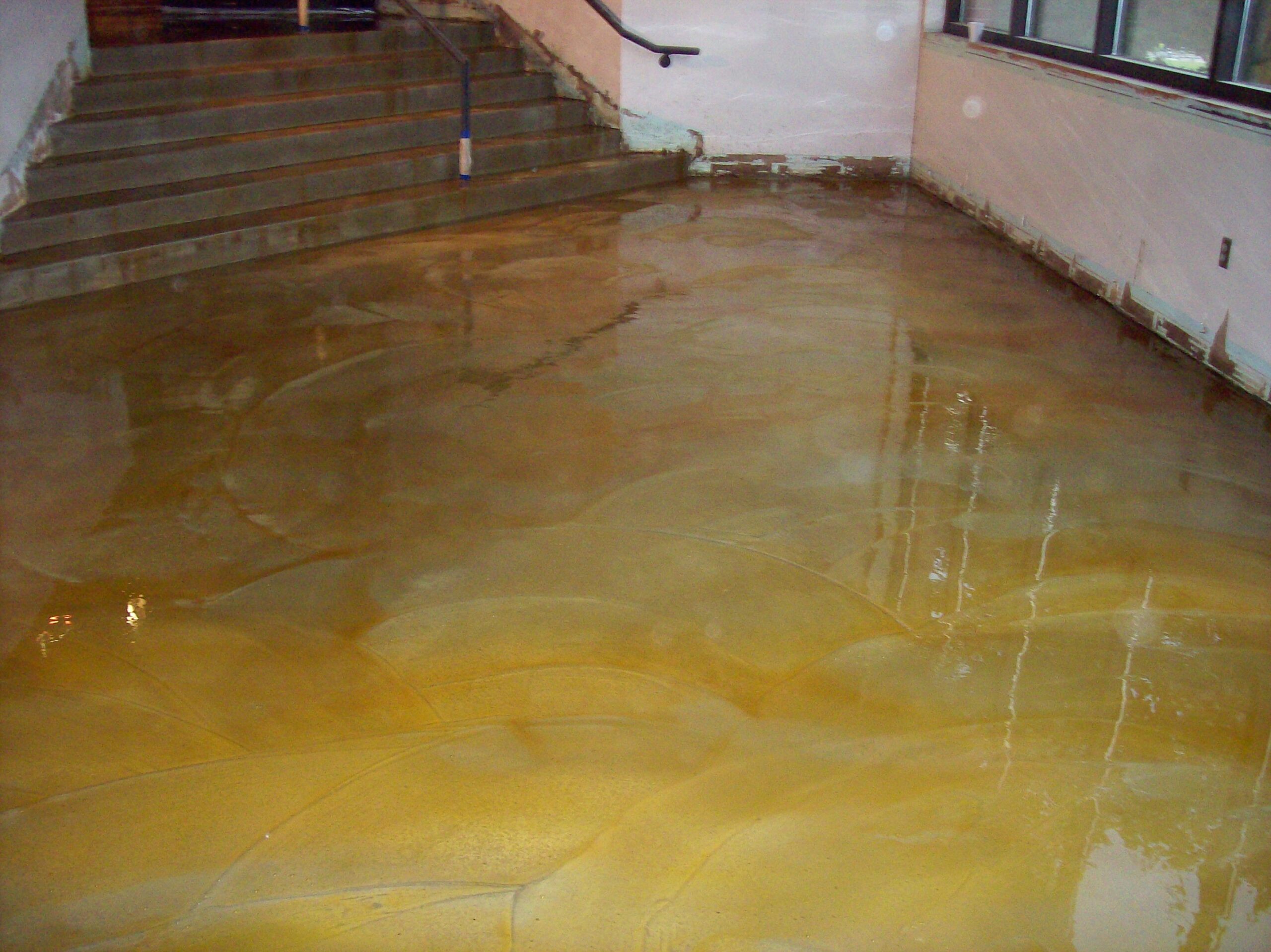 Acid staining swirl finish concrete overlay
