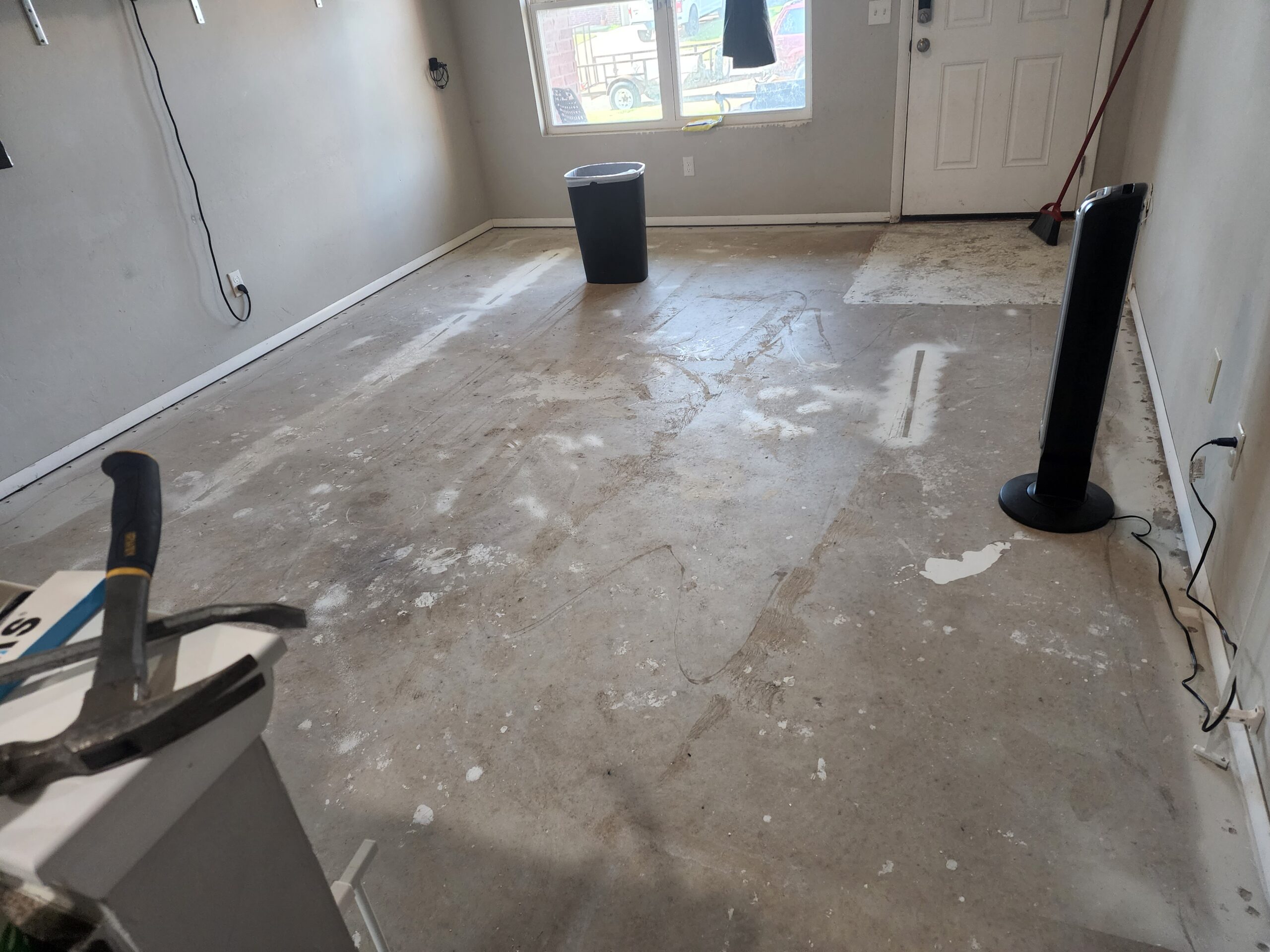 Concrete floor after removing carpet