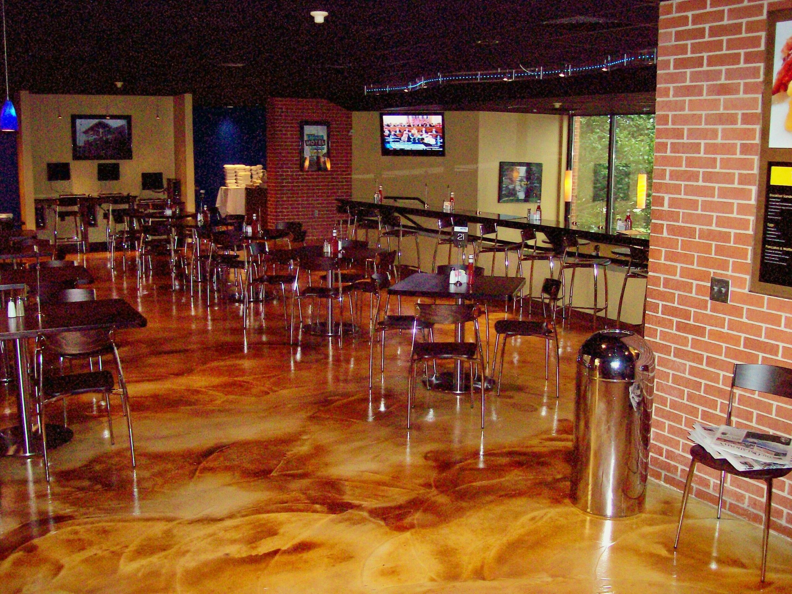 Acid stained swirl finish concrete overlay floor