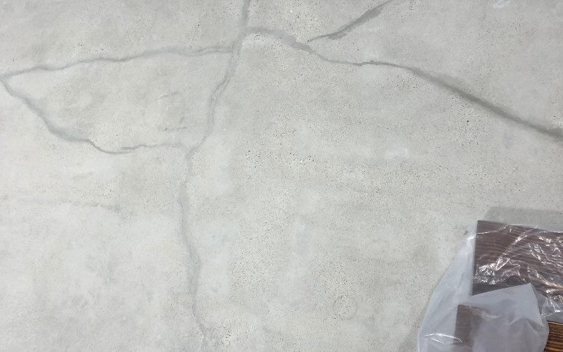 Small hairline cracks being filled with cement mix