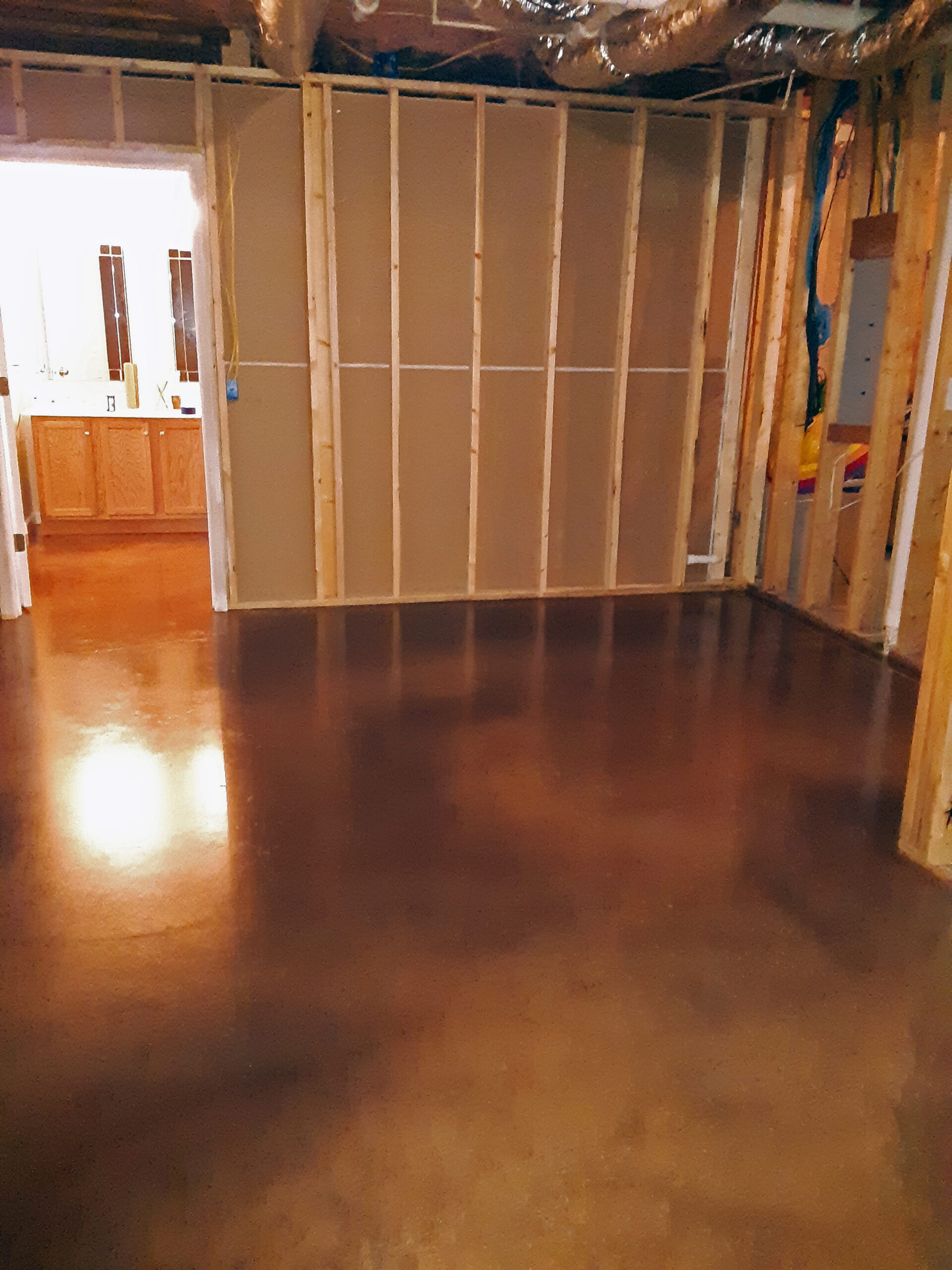 after-vibrance-dye-aztec-brown-driftwood-malayan-concrete-basement Aztec brown, driftwood and malayan buff Vibrance dyed concrete floor