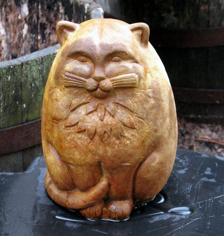 concrete cat stained with malayan buff DecoGel acid stain