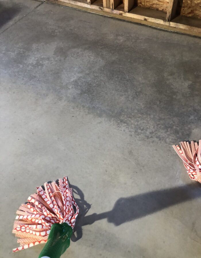 White Stain Applied to Concrete Floor Using Handheld Pump Sprayer and Dry Mopped