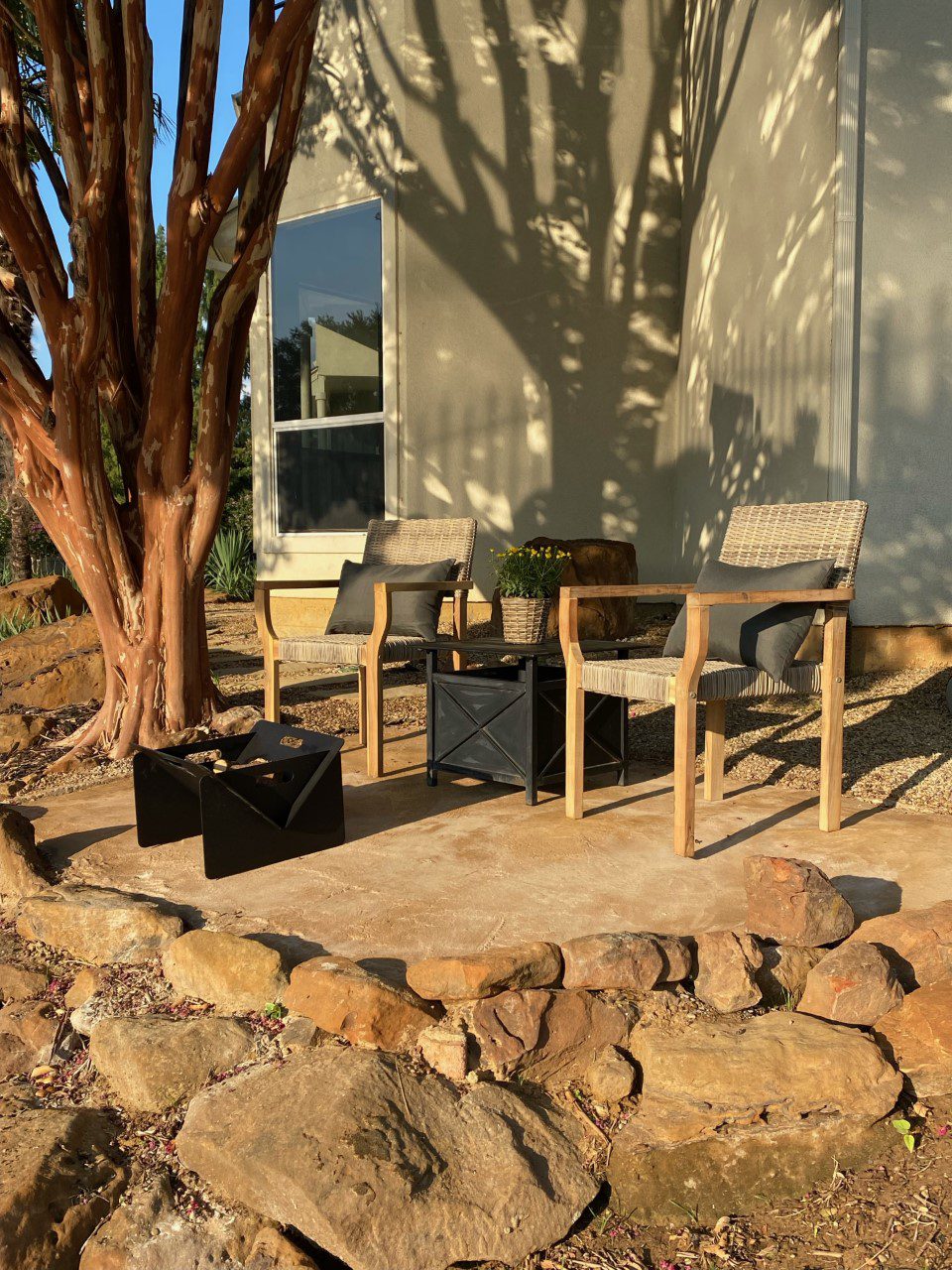A finished DIY poured concrete patio featuring a warm and rustic look, achieved through the simple application of Antiquing Cafe Royale stain.