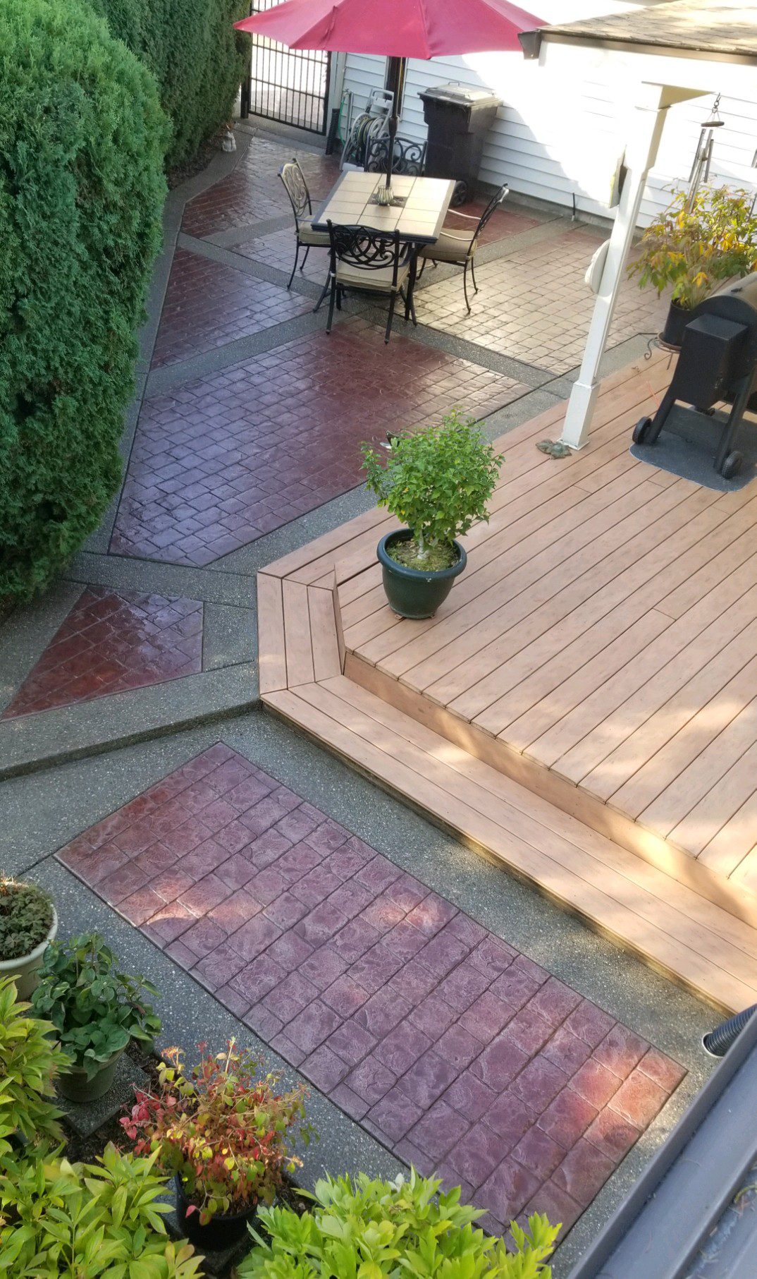 Full view of the rejuvenated patio, gleaming in its complete Cinnabar stained glory