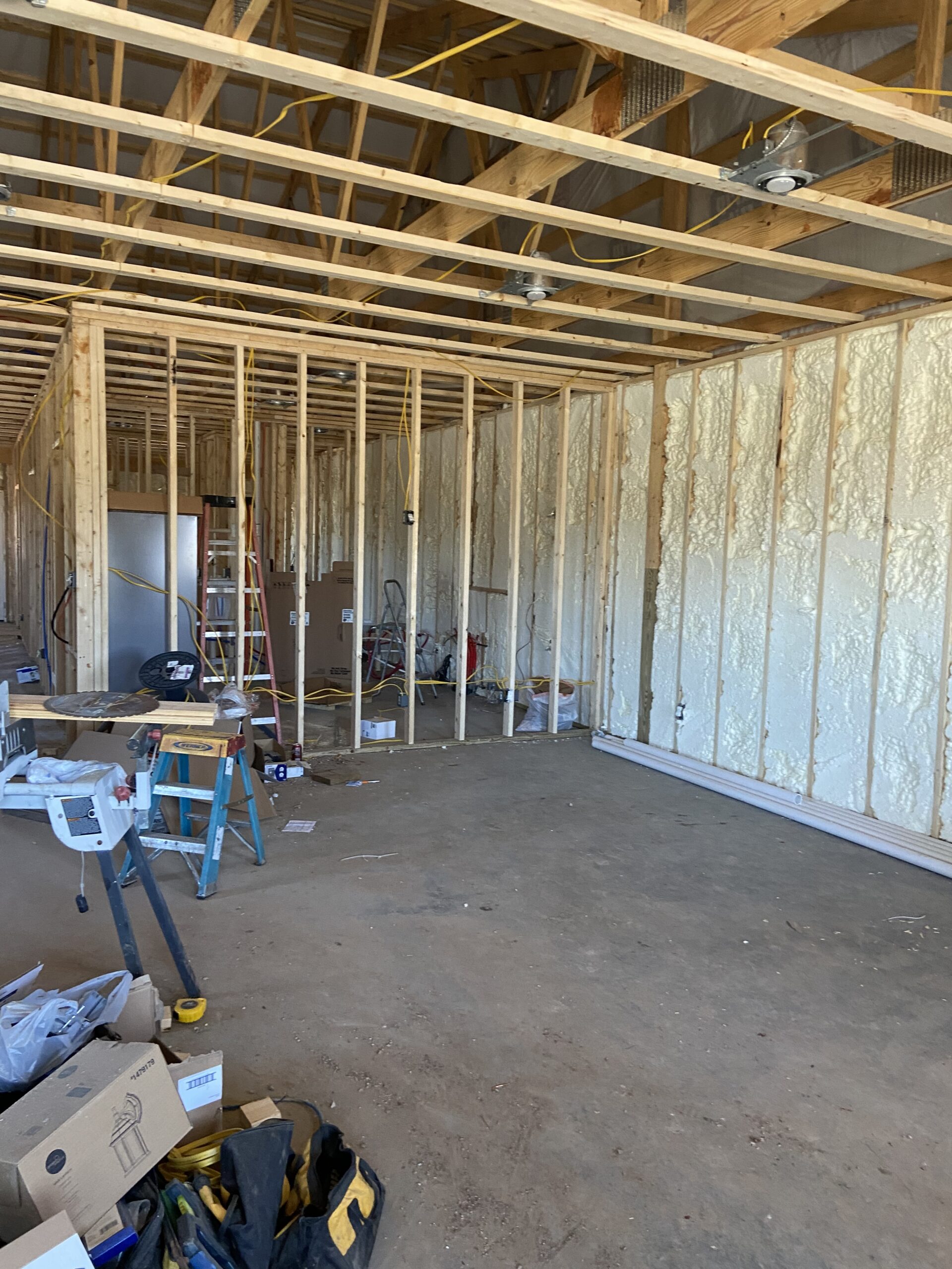 A photo displaying a bare, unprocessed concrete floor in a newly constructed house