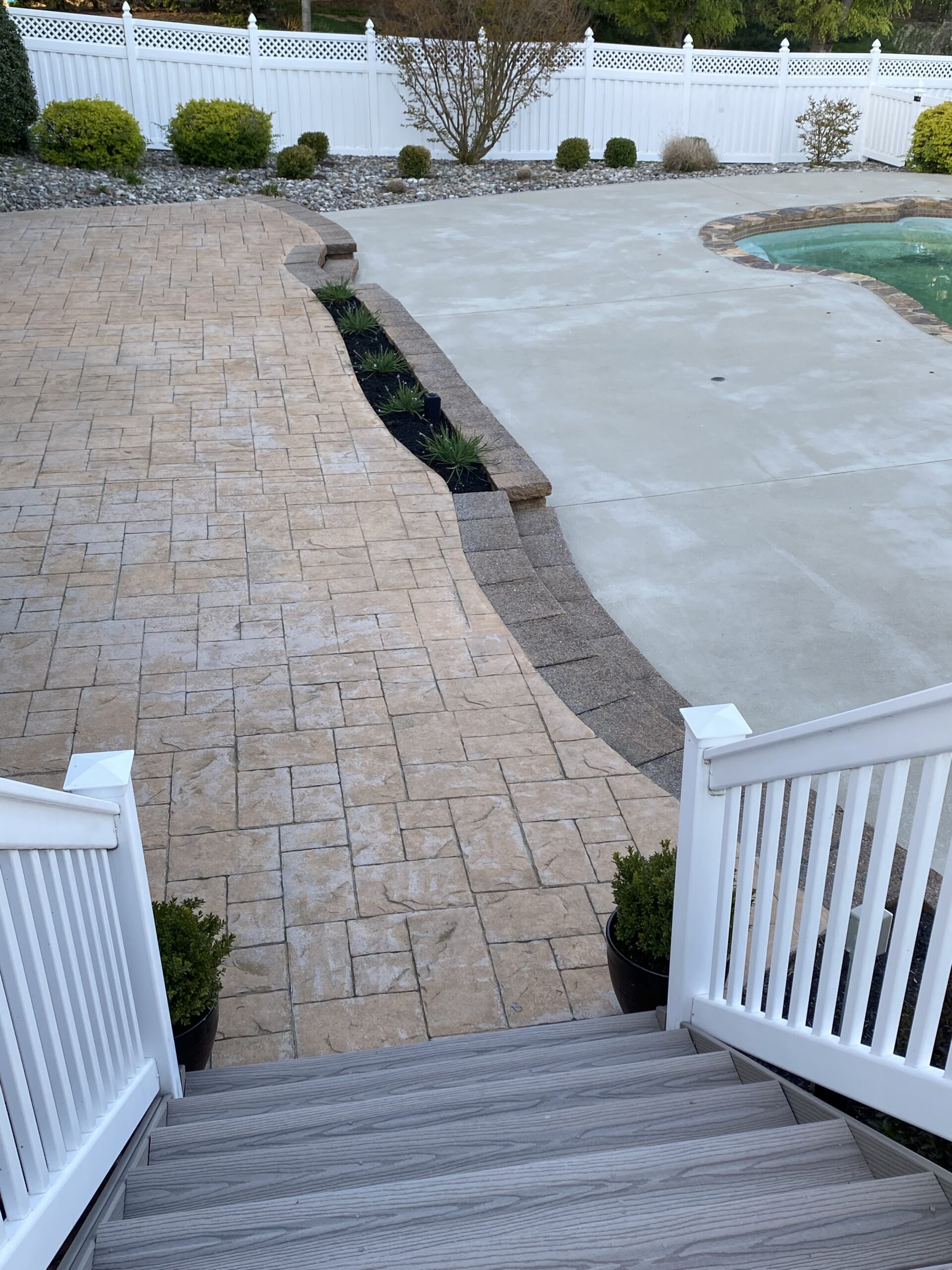 Faded brown, stamped concrete floor before the application of stain