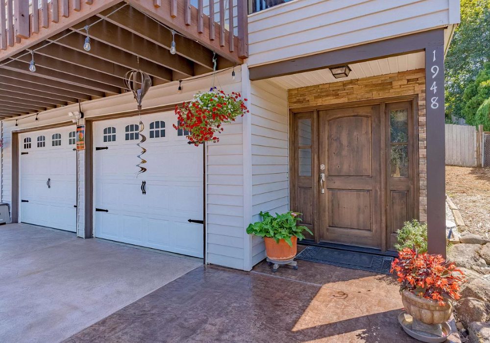 Broomed concrete driveway and front porch stained in Aztec Brown and Sunset Tan