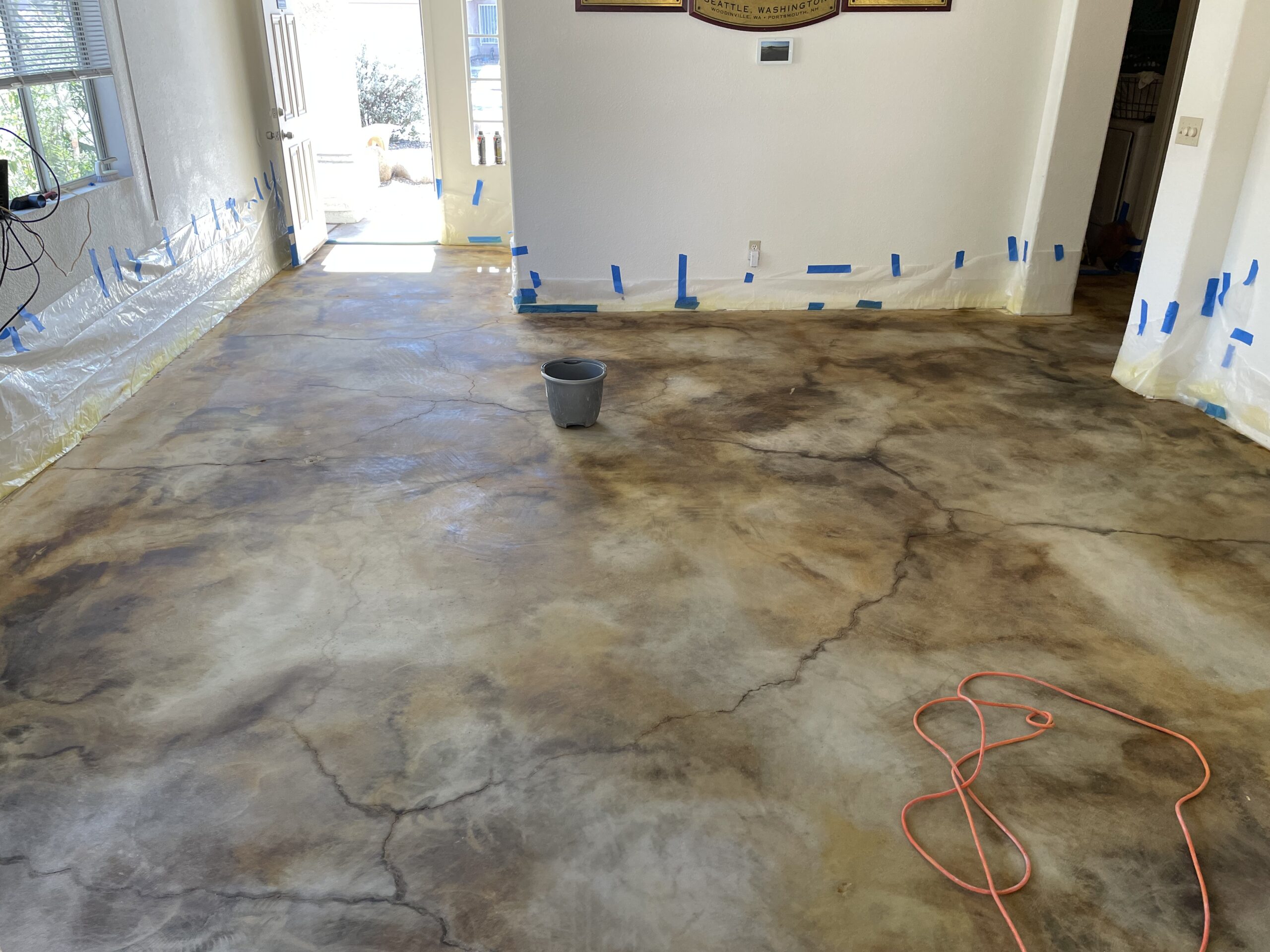 An image of the living room floor after the acid staining has been neutralized and cleaned, the floor appears dry