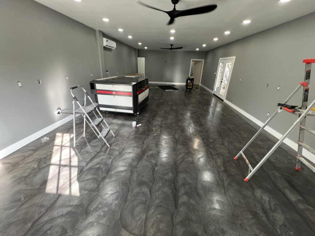 Handmade, uneven swirl patterns across the shop floor, resulting from the sponge staining technique, showcasing its distinct charm.